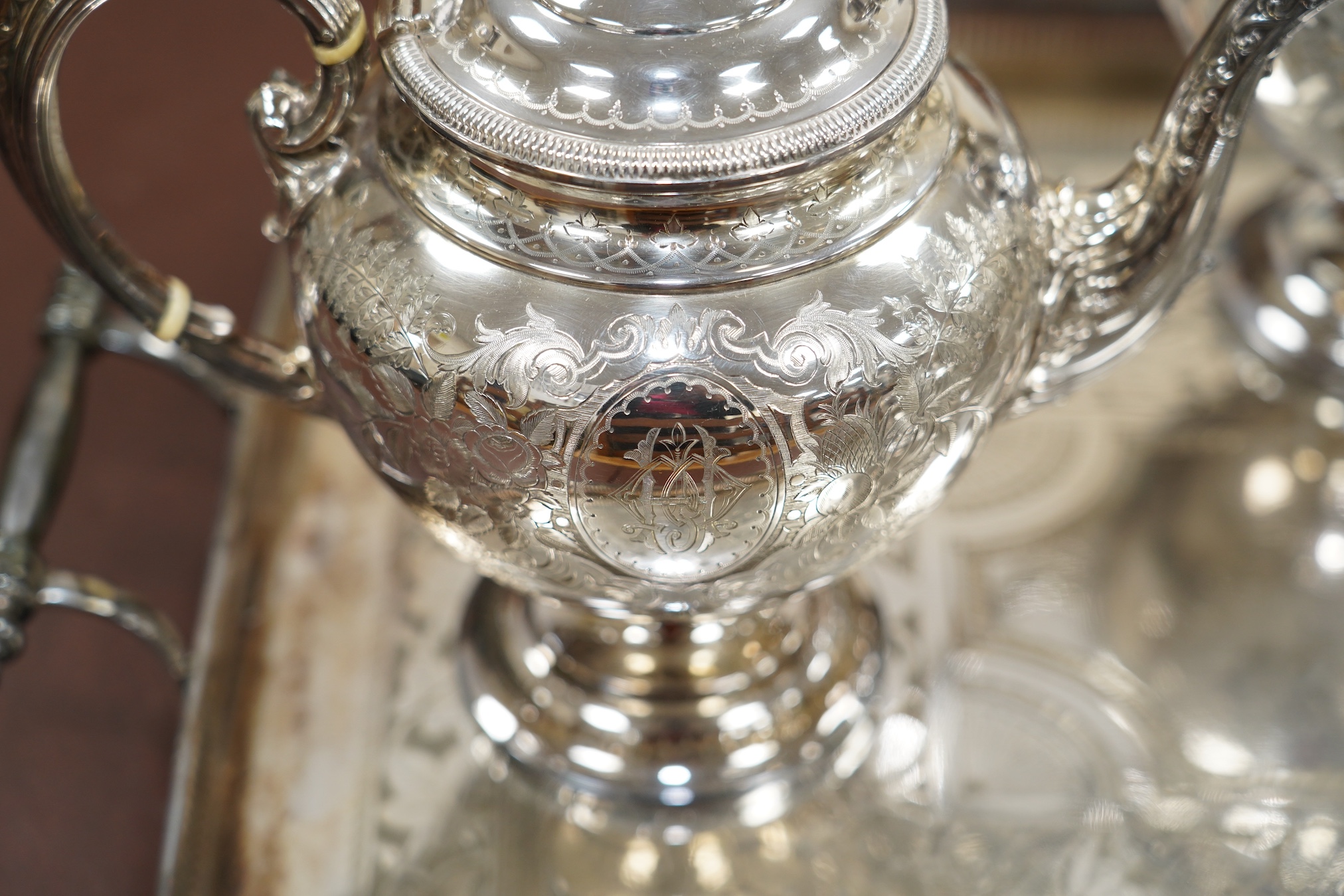 A Victorian four piece plated teaset and a tray. CITES Submission reference 6R2FT6J1. Condition - good